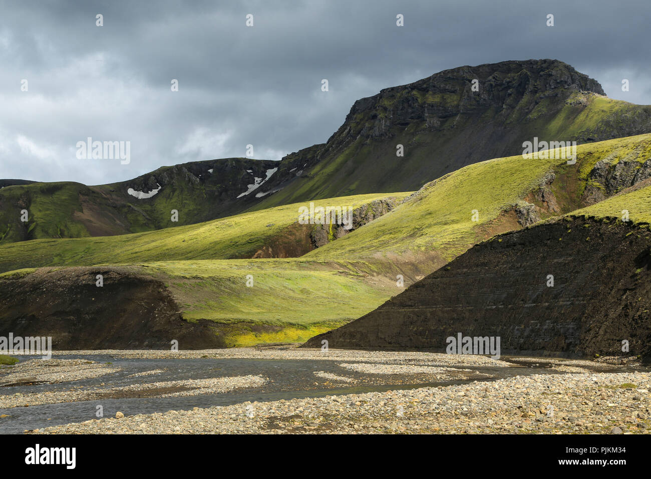 Iceland, river landscape, Liosa, green hills, dramatic light Stock Photo