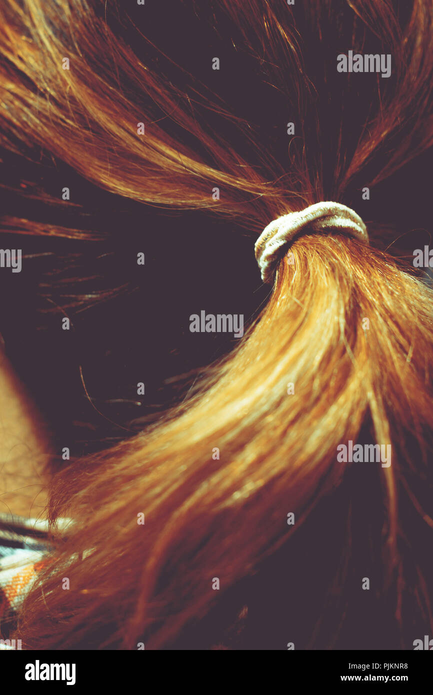 Close-up of a hair tie in the hair of a brunette woman Stock Photo