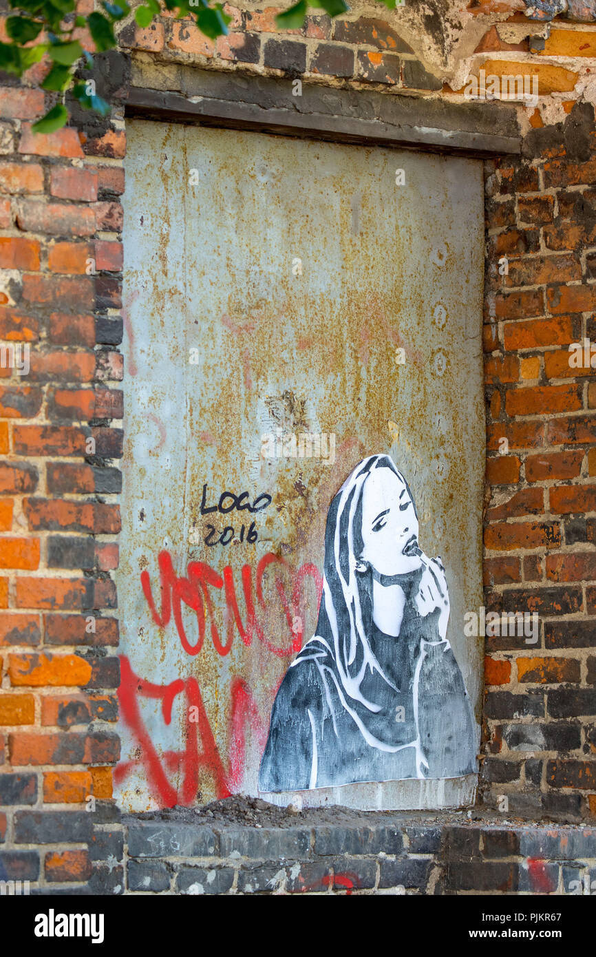 Graffiti with young woman, street scene, Gdansk, Danzig, Baltic Sea coast, Baltic Sea, pomorskie, Pomeranian Voivodeship, Poland Stock Photo