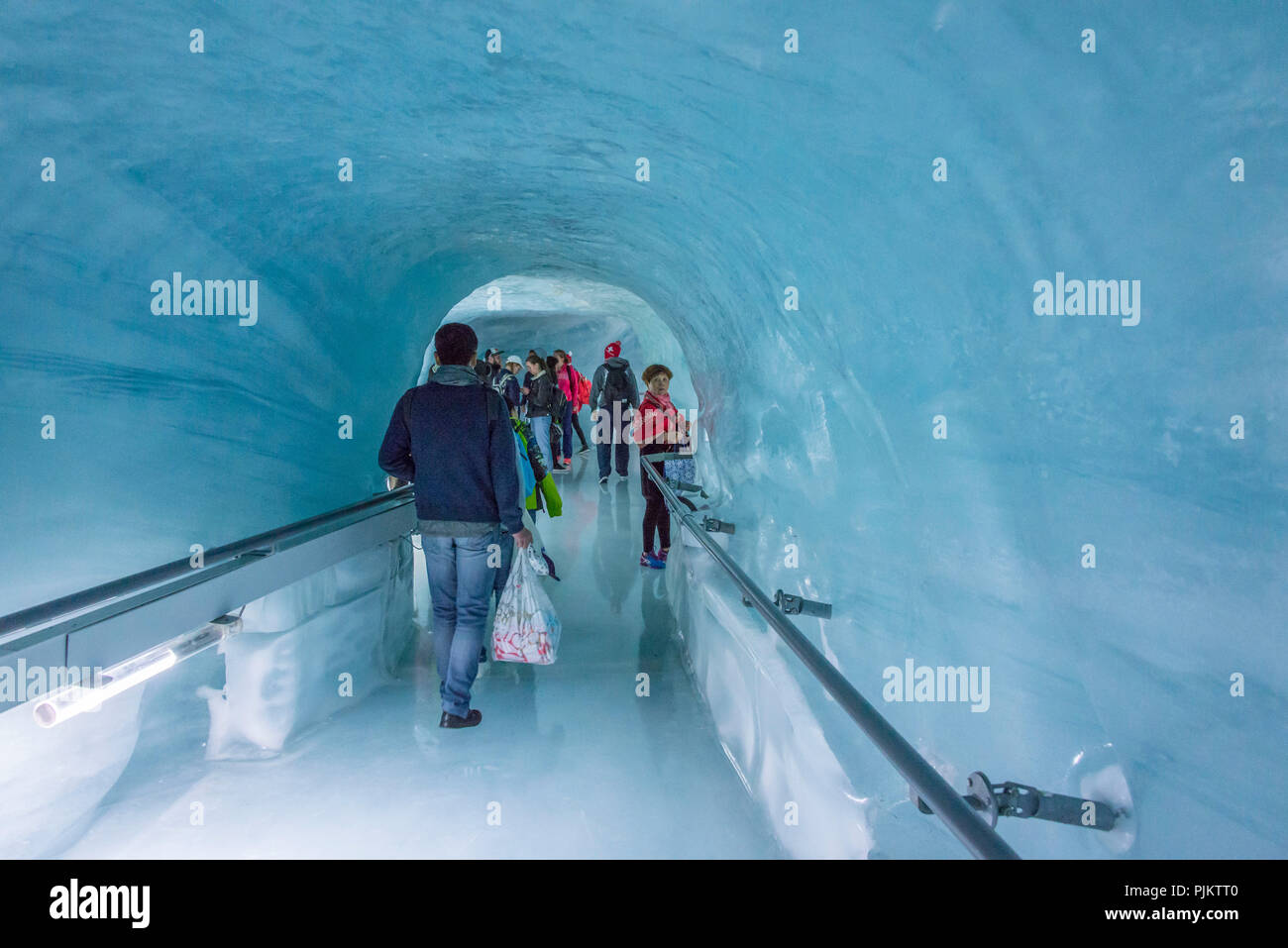 Tourists in the Jungfrau Railway Ice Palace, at Jungfraujoch, near