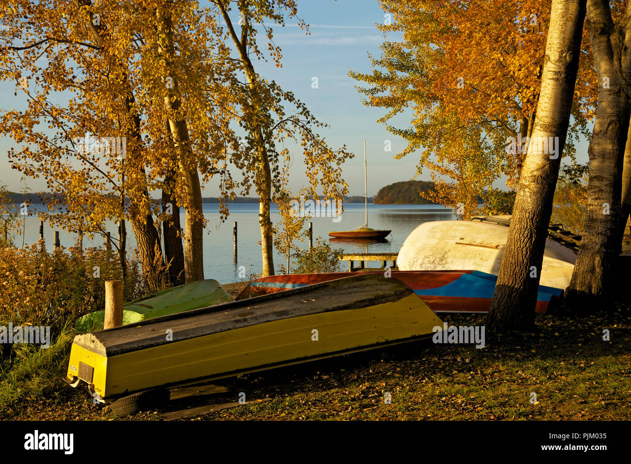 Autumn evening at the boat mooring in Bosau am Lake Plön. Stock Photo