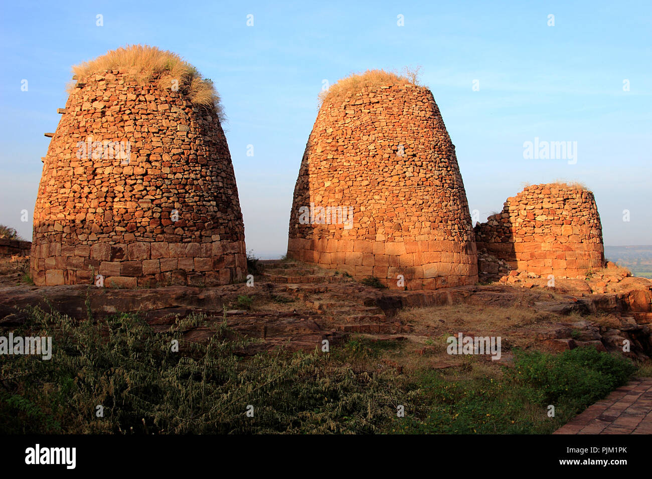 Three watch towers in evening sunlight against blue sky on top of northern hill at Badami, Karnataka, India, Asia Stock Photo