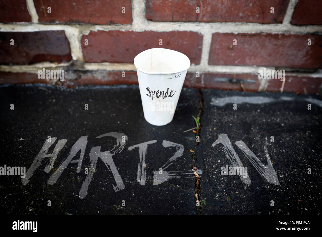 Donation cup, Hartz IV Stock Photo