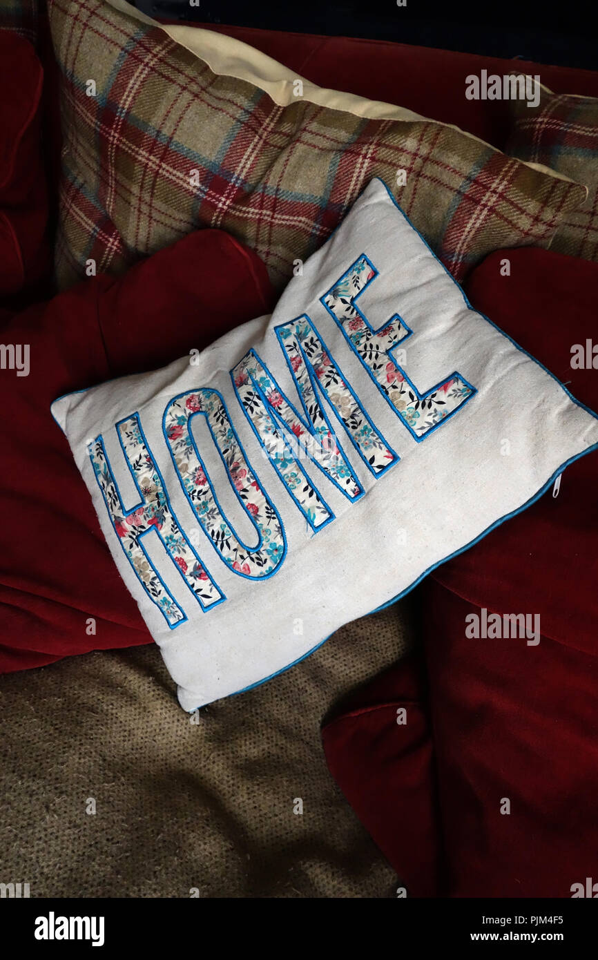 Embroidery of the word 'Home' word on sofa cushion Stock Photo