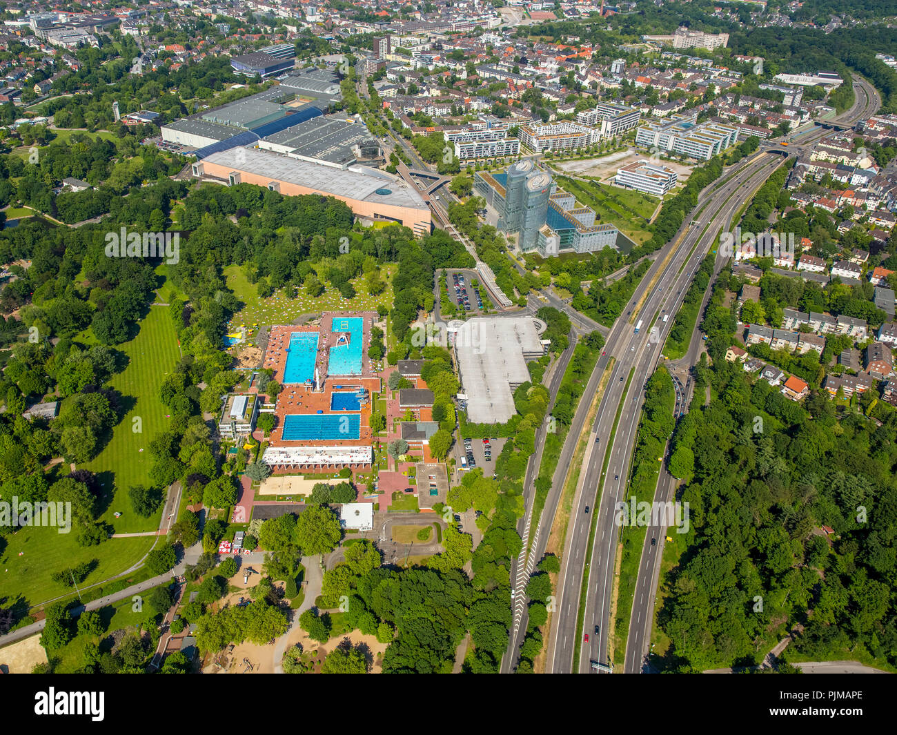 Bathers, sunbathing, swimming pool, sunbathing areas, bath towels, bathers, swimmers, pool area, Grugabad Essen, outdoor swimming pool on the hottest day in spring 2015, Essen, Ruhr area, North Rhine-Westphalia, Germany Stock Photo