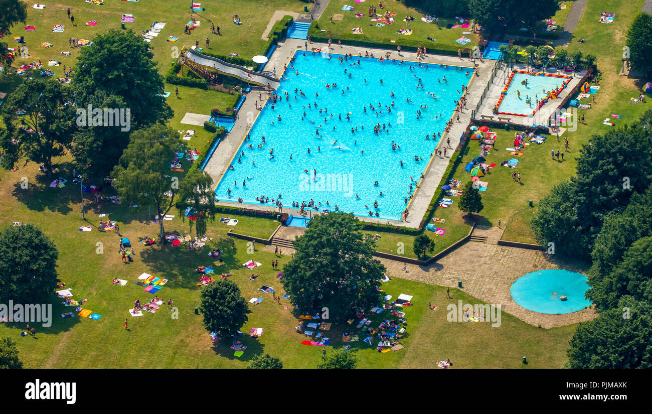 Outdoor swimming pool Werne with swimming pool, paddling pool and sunbathing areas with shadow, Dortmund, Ruhr area, North Rhine-Westphalia, Germany Stock Photo