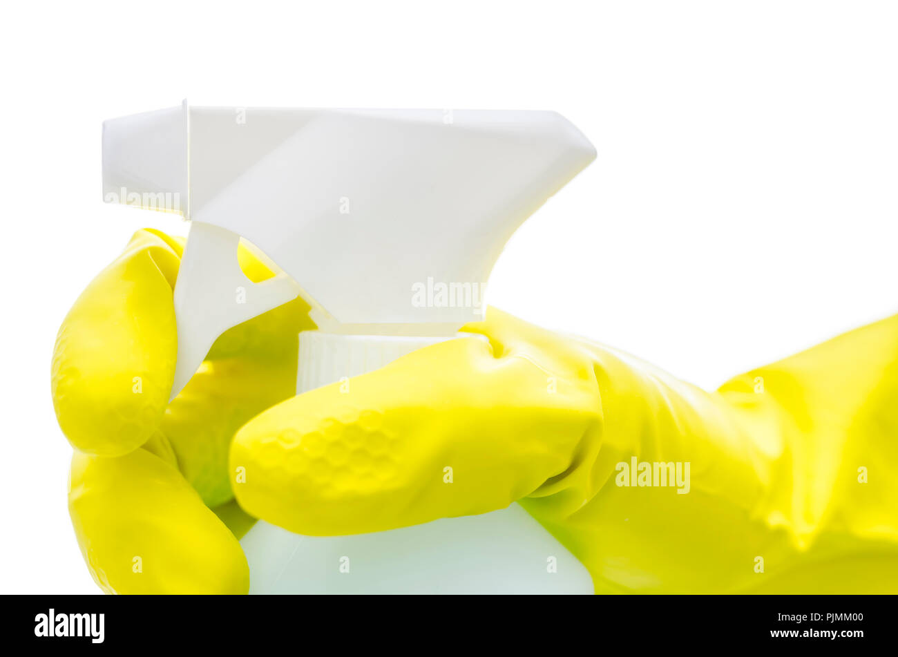 Side view of a hand in a yellow rubber glove holding a spray bottle ...