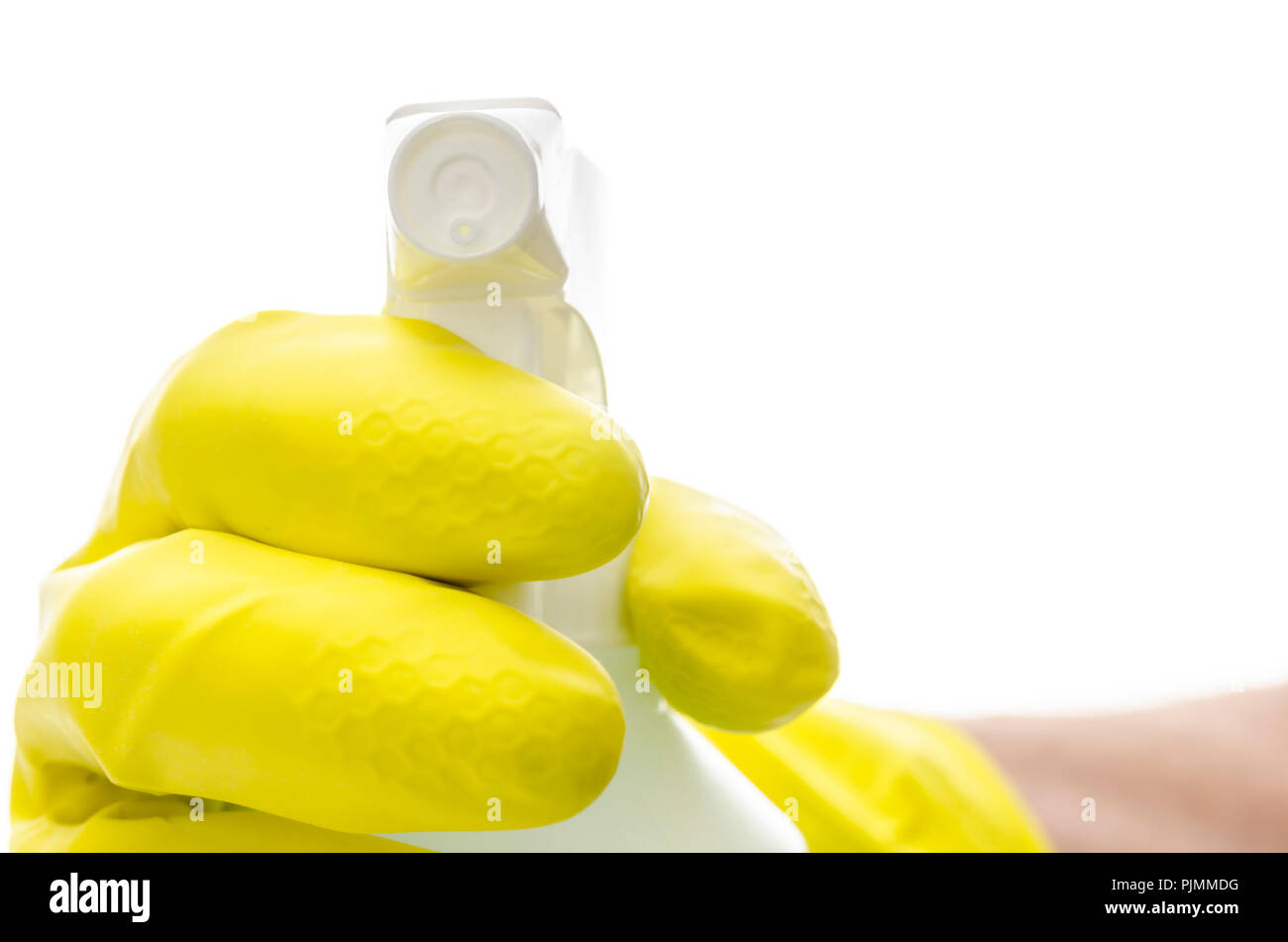 Hand in a rubber glove holding a detergent spray towards you. Isolated ...