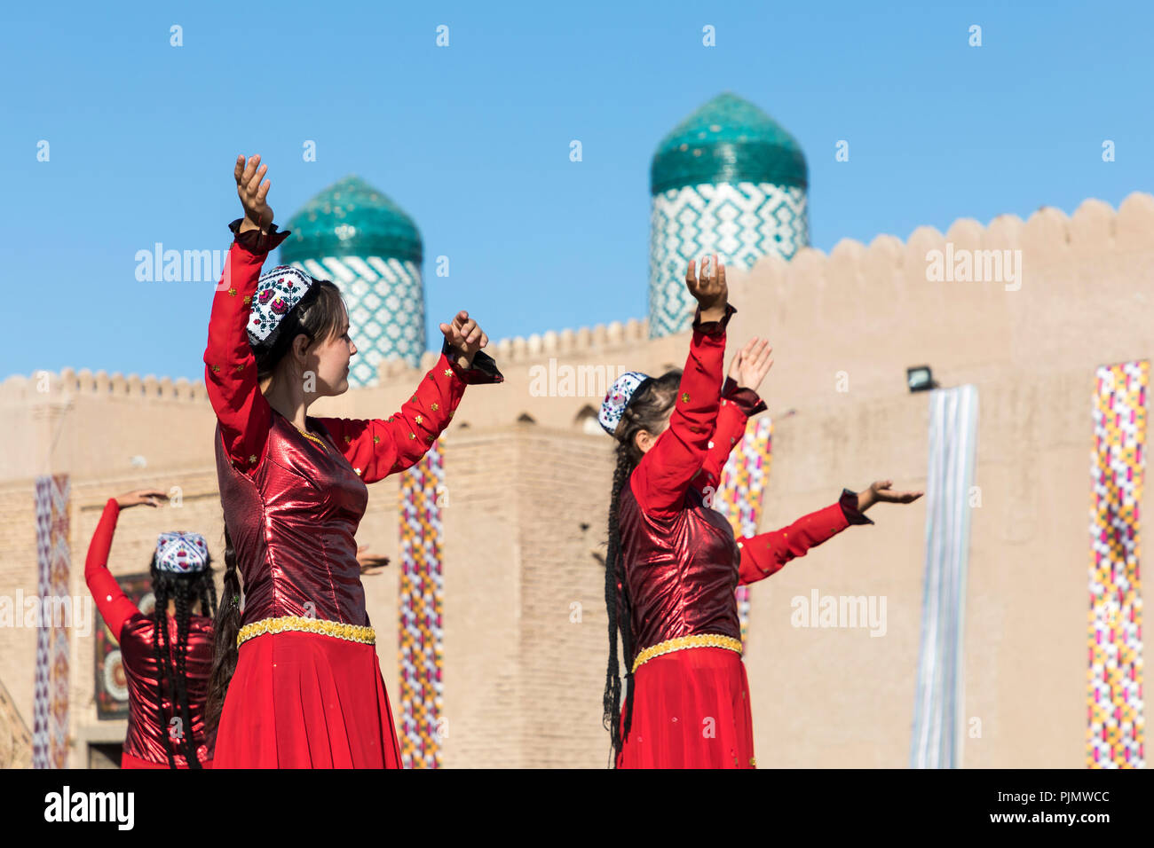 KHIVA, UZBEKISTAN - AUGUST 26, 2018: Folk dancers performs traditional dance at local festivals. Stock Photo