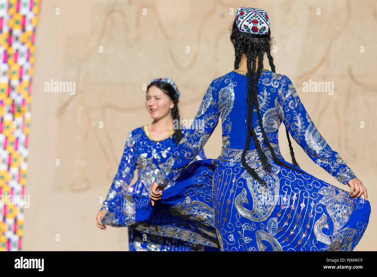 KHIVA, UZBEKISTAN - AUGUST 26, 2018: Folk dancers performs traditional dance at local festivals. Stock Photo