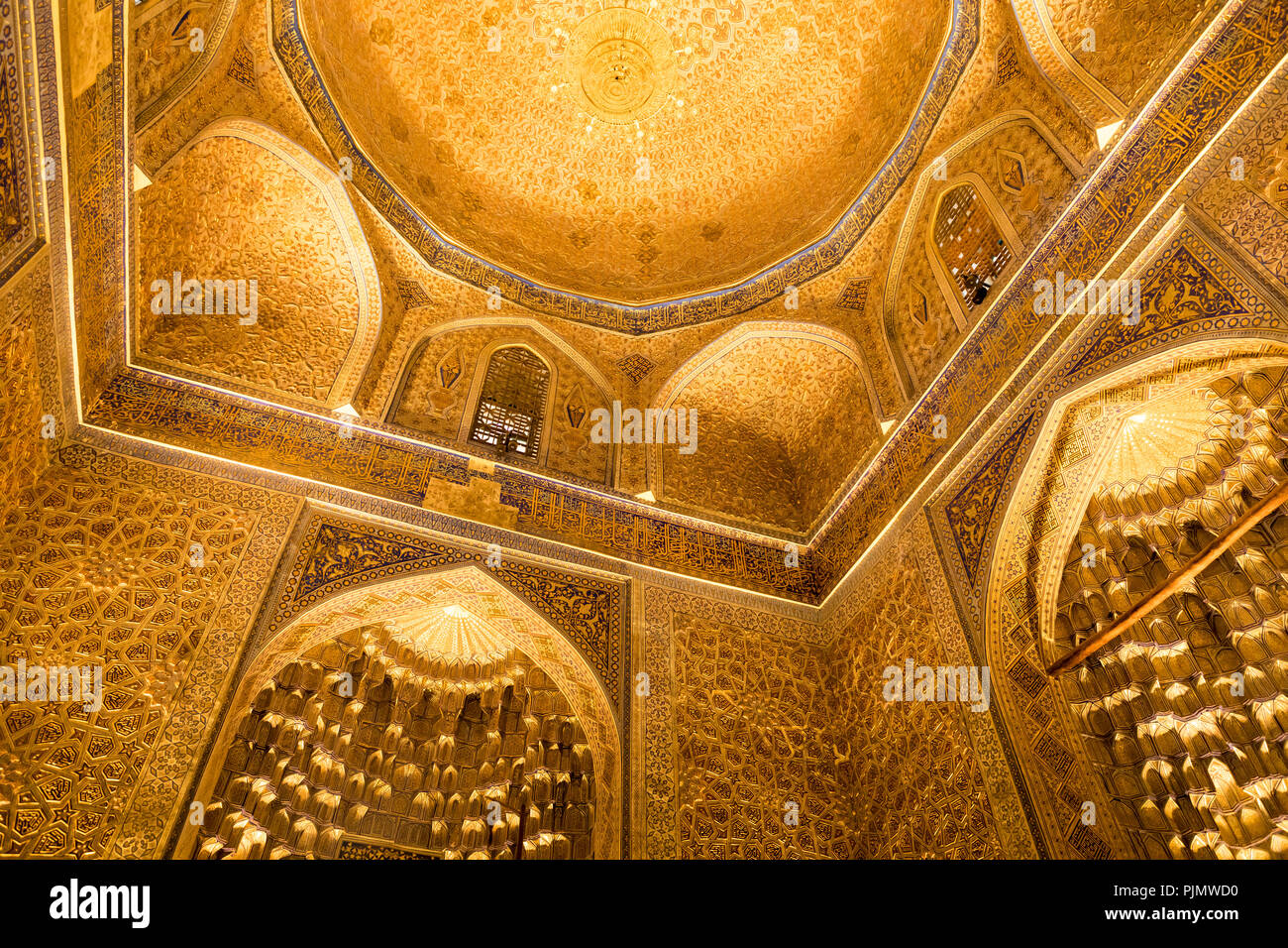 SAMARKAND, UZBEKISTAN -SEPTEMBER 01, 2018: Amir Temur (Tamerlan) tomb in Samarkand, Uzbekistan. Wall's and ceiling golden mosaic decoration in Persian - Stock Image