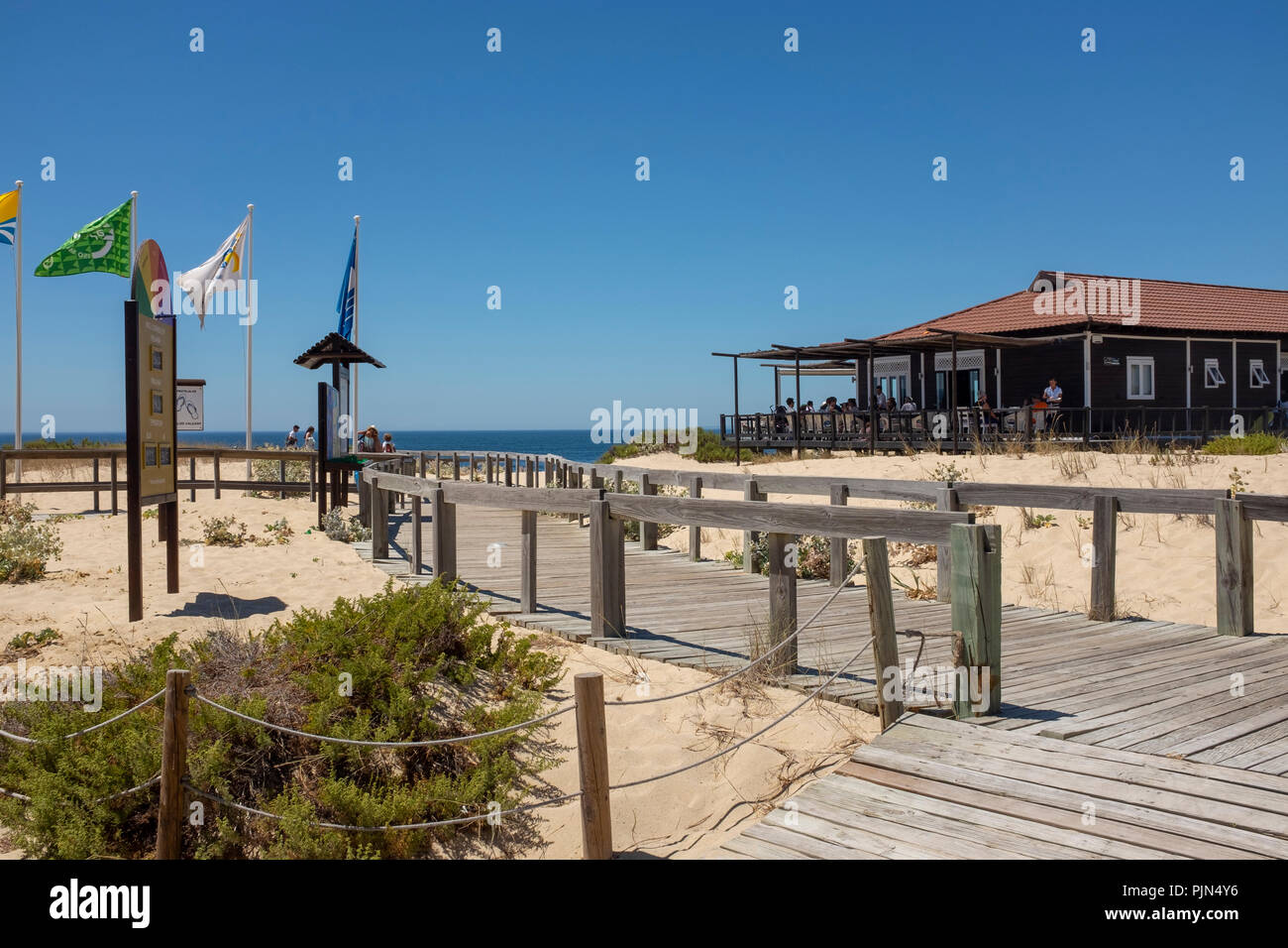 The public boardwalk leading down to Praia do Pego (Pego Beach), past Restaurante Sal, in Carvalhal, Portugal Stock Photo