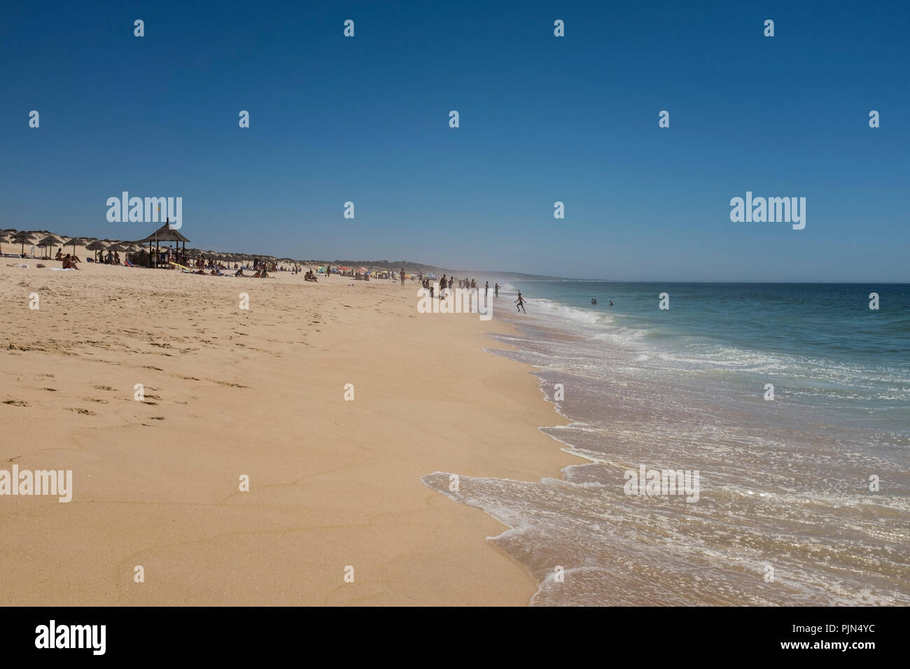 People on the beach at Praia do Pego, also known as Pego Beach, Carvalhal, Portugal, during summer Stock Photo
