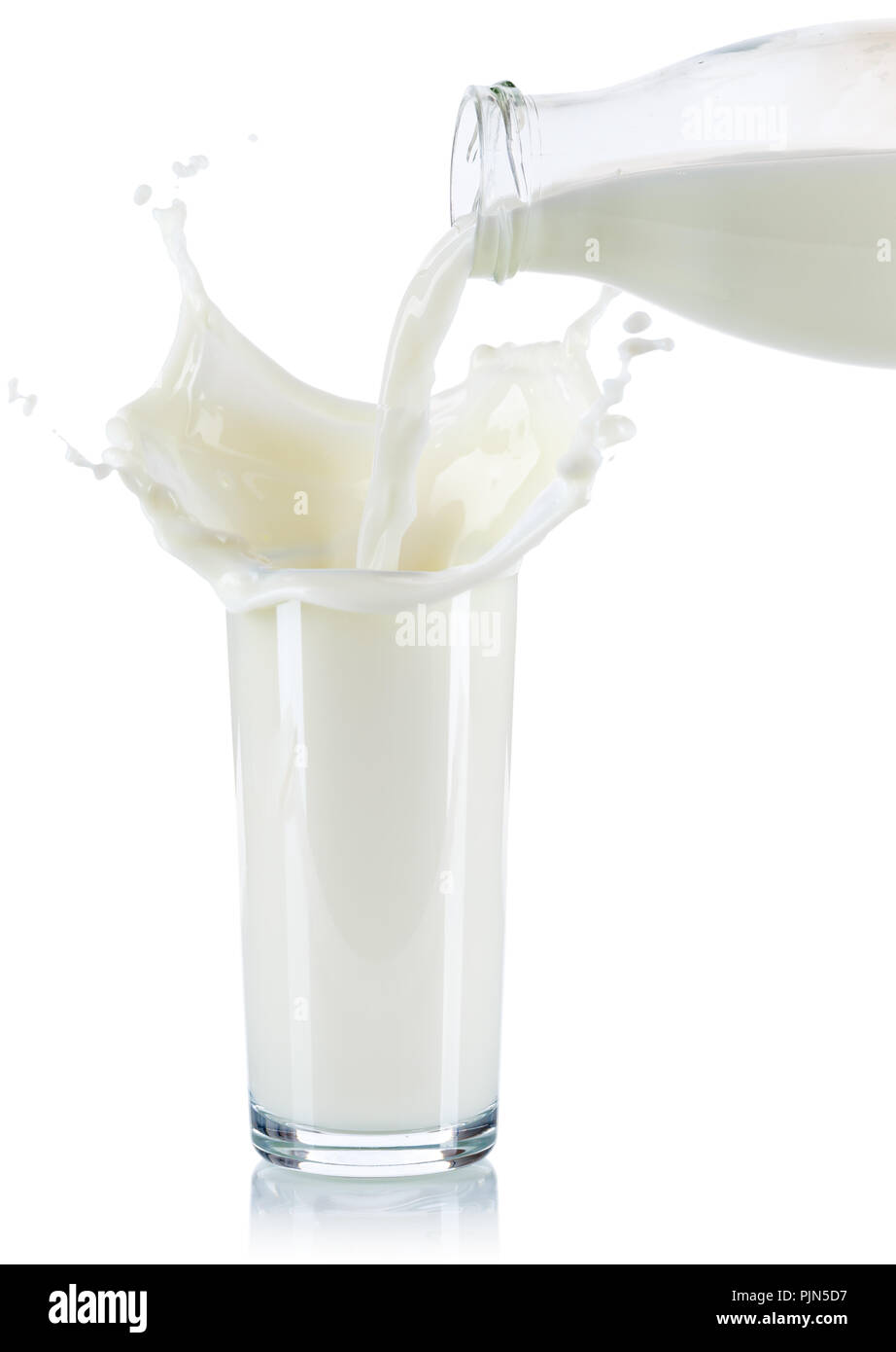Milk splash splashing pouring pour glass bottle isolated on a white background Stock Photo