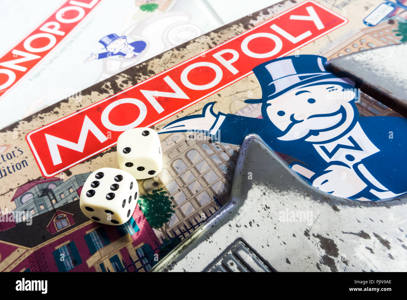 Monopoly Board Game close up with the box, board and dices. The classic