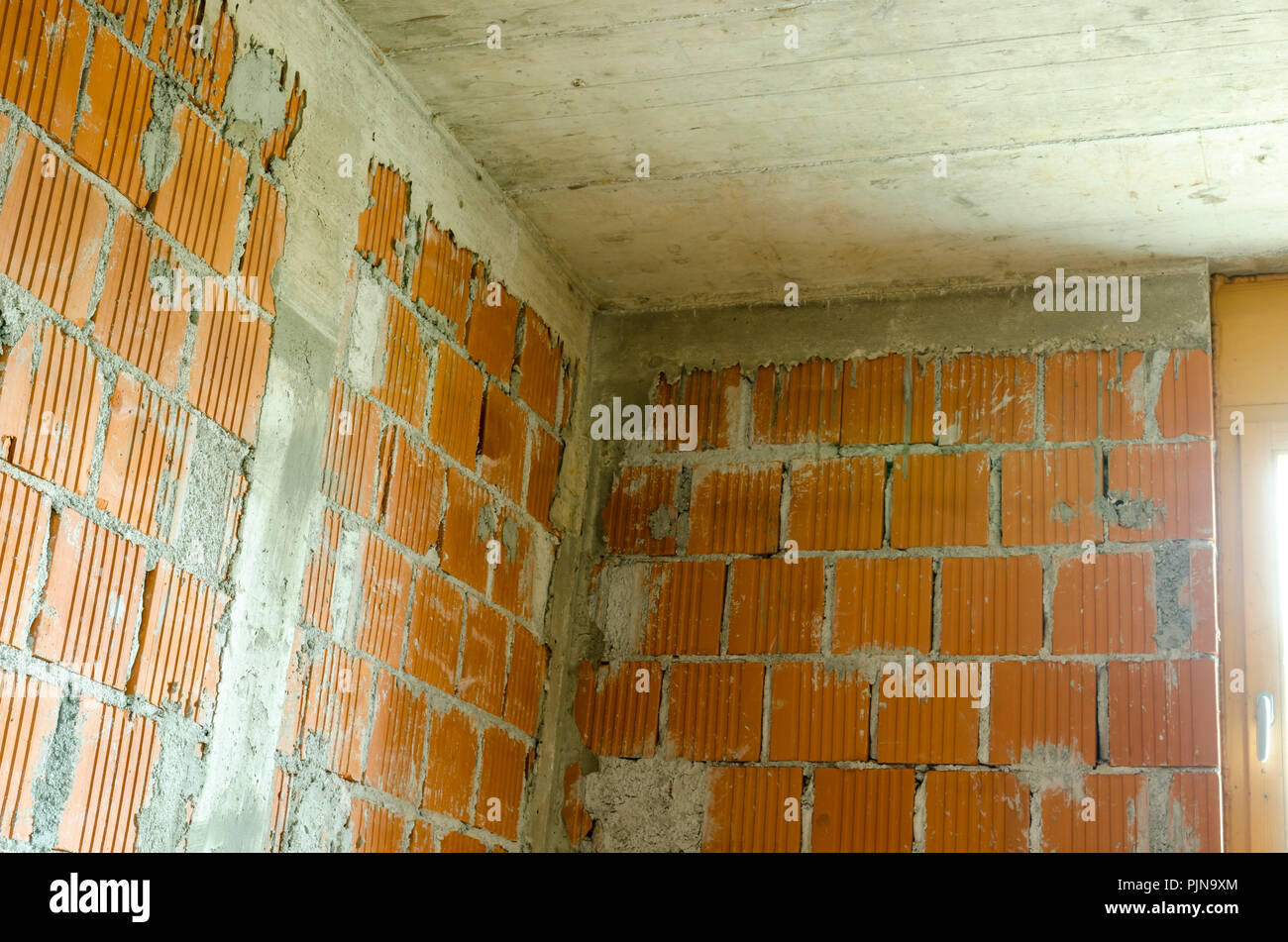 Detail Of Brick Walls And Concrete Ceiling Of A Room In
