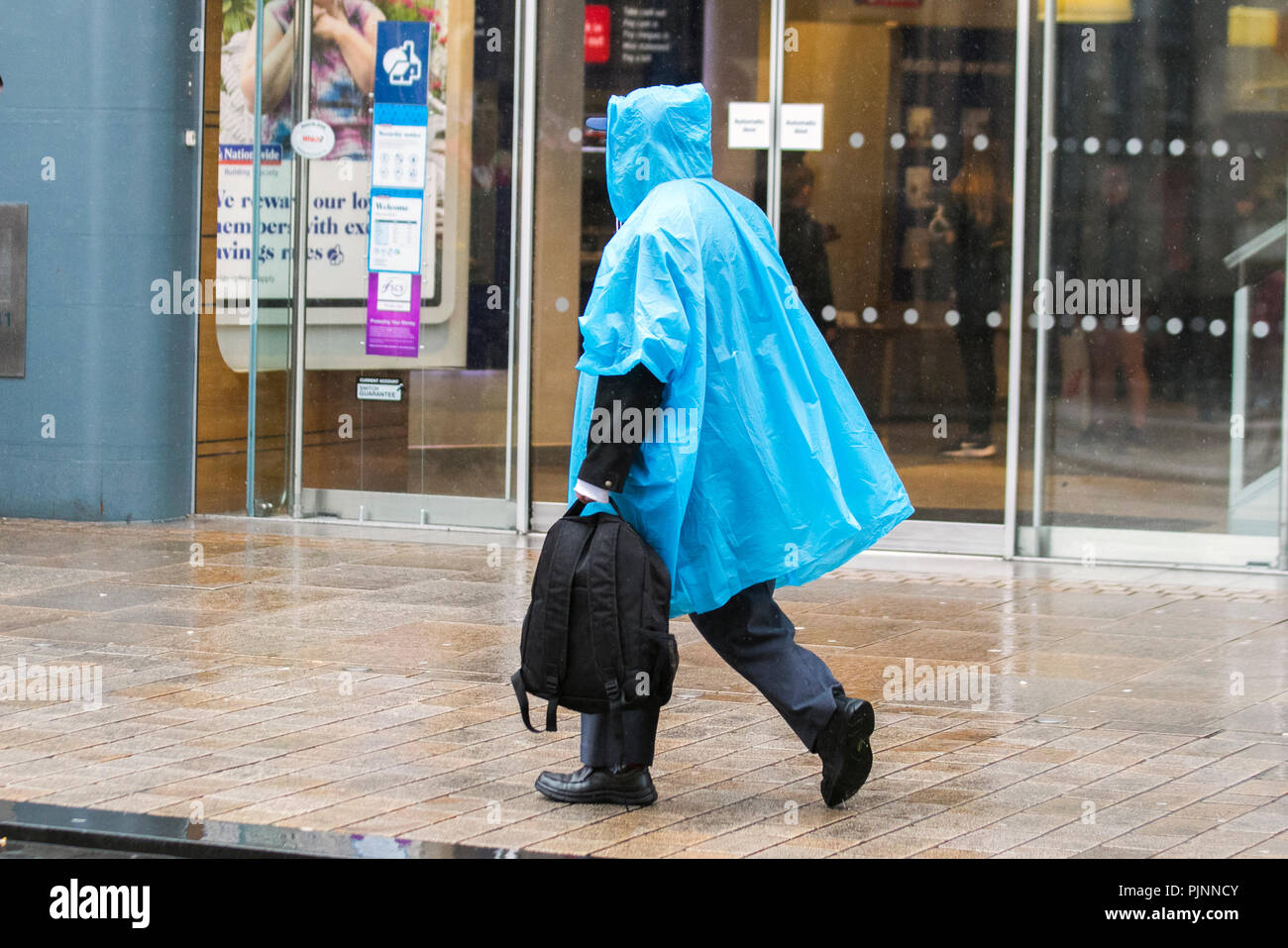 Blue cagoule hi-res stock photography 