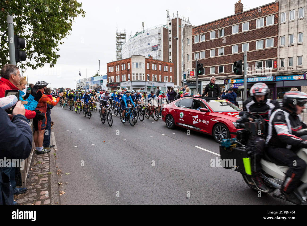 West Bridgford, Nottingham, UK 8th September 2018. Spectators watch and photograph as the Tour of Britain cycle race passes over Trent Bridge in West Bridgford, Nottingham.  Credit: Martyn Williams/Alamy Live News Stock Photo