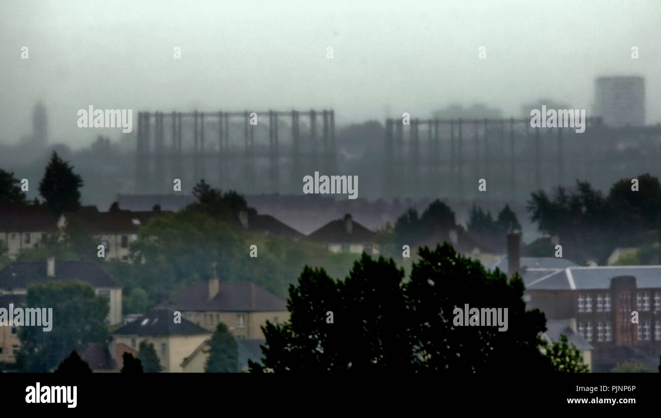 Glasgow, Scotland, UK. 8th September, 2018. UK Weather: Rain and mist cause limited visibility over the city as the west of Glasgow disappears behind the kelvindale gasometers and the rooftops of the suburb of knightswood . Gerard Ferry/Alamy news Stock Photo