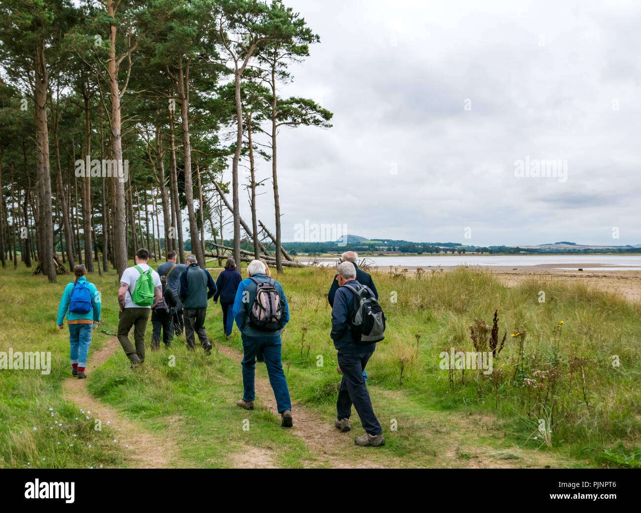 John Muir Country Park, Dunbar, East Lothian, Scotland, UK, 8th September 2018. A small group of people enjoy a guided walk and talk by David Connelly of East Lothian Council Archaeology Service examining evidence of a rediscovered Neolithic agricultural settlement and World War defensive locations during East Lothian Archaeology and Local History Fortnight which takes takes place in September each year, and is part of the annual Scottish Archaeology month Stock Photo