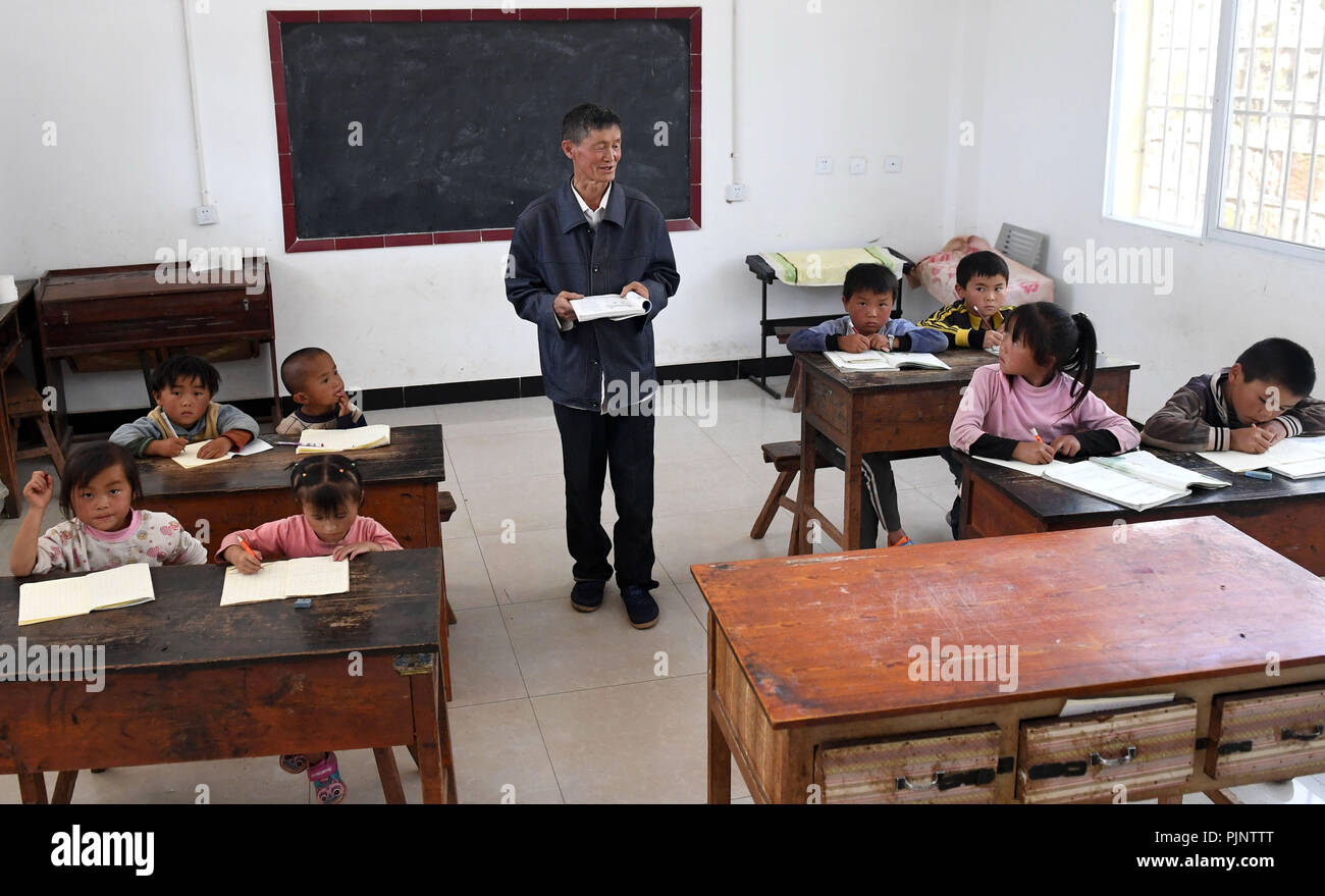 Yunnan Province, China. 8th Sept 2018. Wang Zhengxiang teaches at Ayiyang Primary School in Sanmeng Village of Luquan Yi and Miao Autonomous County, southwest China's Yunnan Province, Sept. 5, 2018. One teacher, eight students, none was and will be given up thanks to rural teacher Wang Zhengxiang. Credit: Xinhua/Alamy Live News Stock Photo