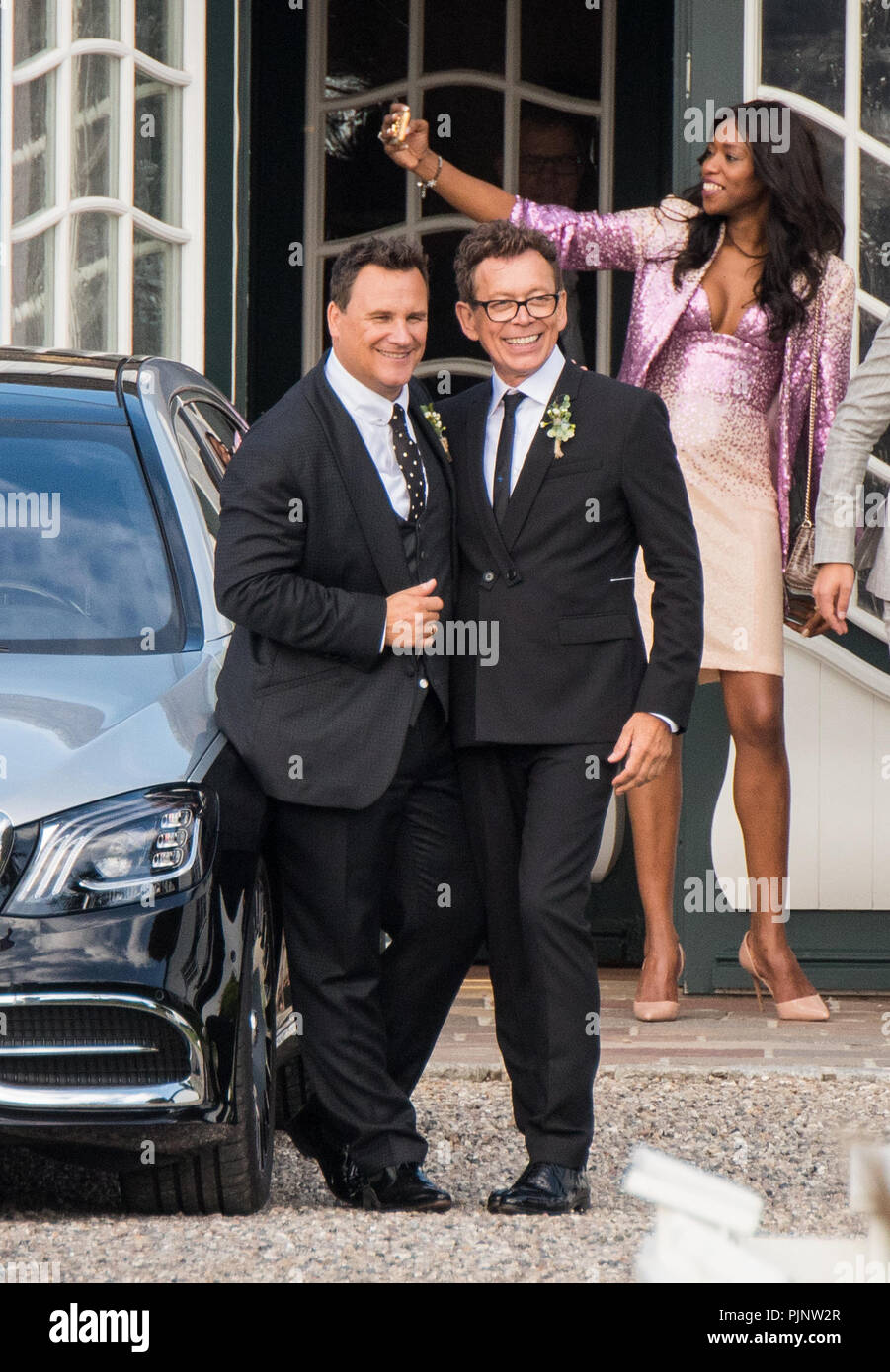 RECROP Sylt, Germany. 8th September 2018.  Guido Maria Kretschmer (L), fashion designer, and his husband Frank Mutters stand together during a reception after their wedding. Photo: Daniel Bockwoldt/dpa Credit: dpa picture alliance/Alamy Live News Stock Photo