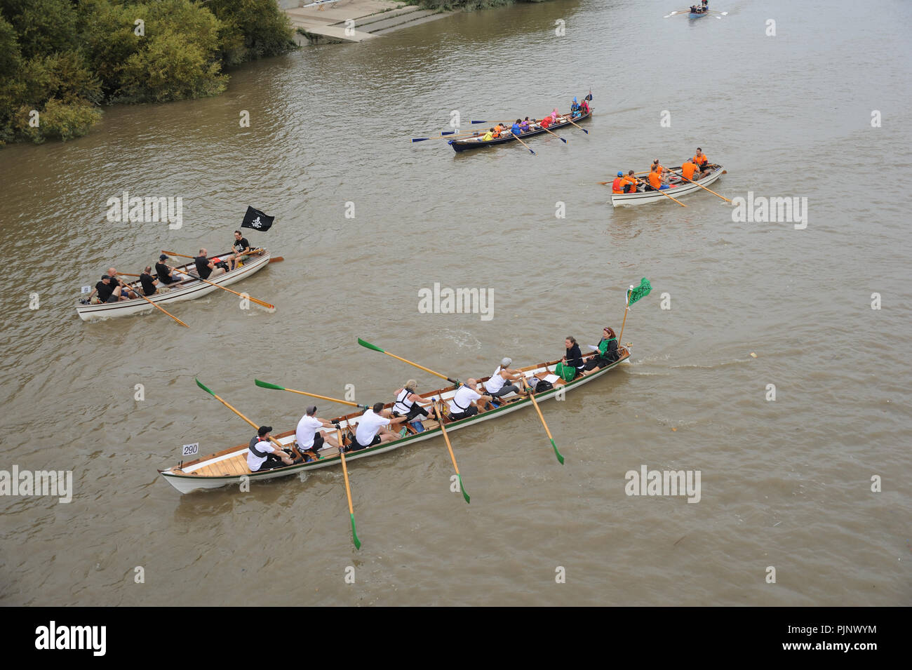 Competitors enjoy the camaraderie and competition in the Thames Great River Race, viewed from Barnes Bridge, SW13. Stock Photo