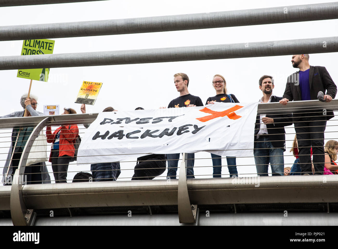 London, UK. 8th Sep, 2018. Environmental campaigners gather on the Millennium Bridge outside Tate Modern, formerly a power station, in support of Rise For Climate, a global day of action involving hundreds of rallies in cities and towns around the world to highlight climate change and call on local leaders to commit to helping the world reach the goals of the Paris Climate Agreement. Credit: Mark Kerrison/Alamy Live News Stock Photo