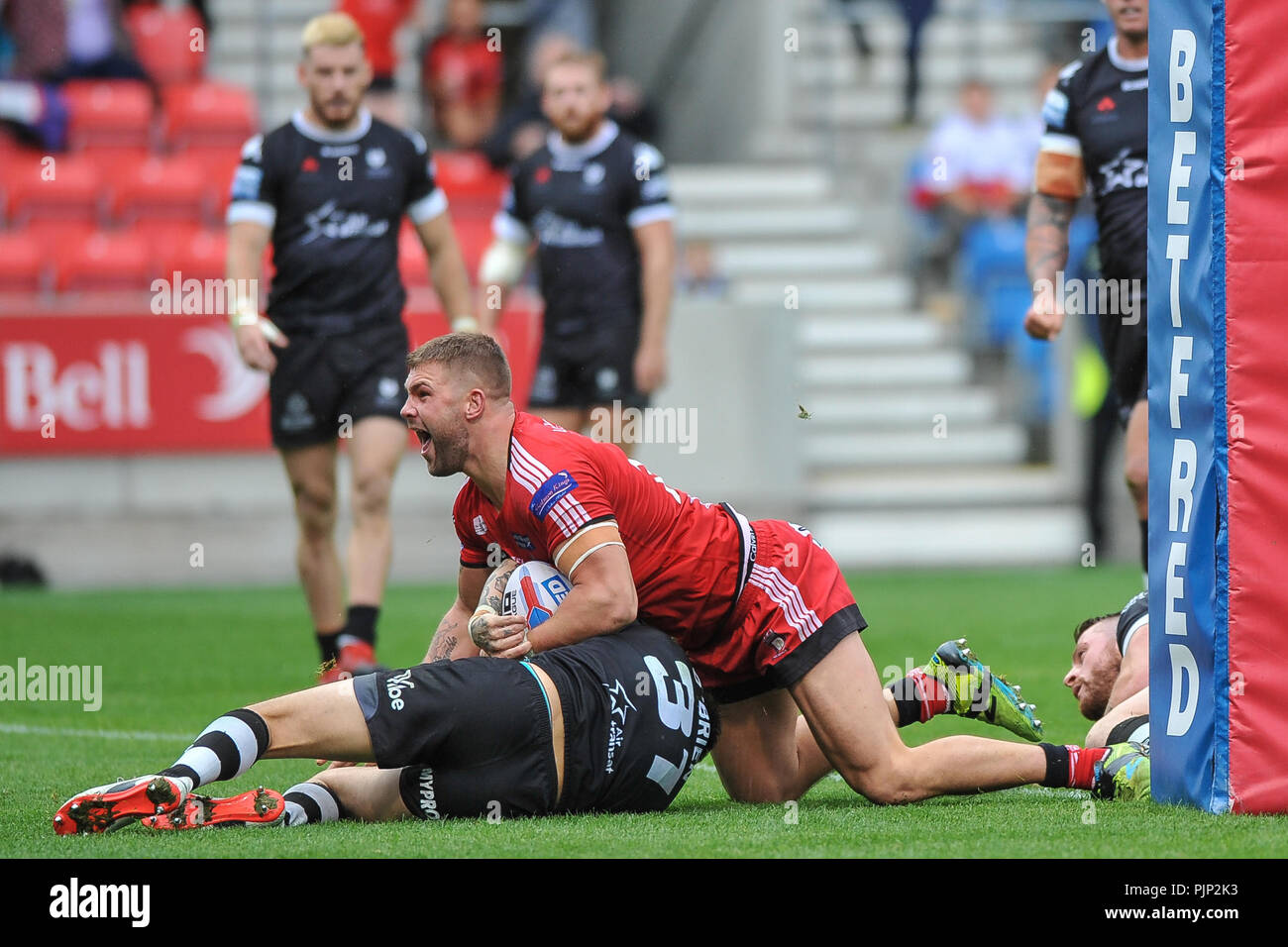 Select Stadium, Salford, UK. 6th September 2018. Rugby League Super 8's Rugby League between Salford Red Devils vs Toronto Wolfpack; Salford Red DevilsÕ Luke Burgess crosses the try line for a late match winner.  Dean Williams Stock Photo