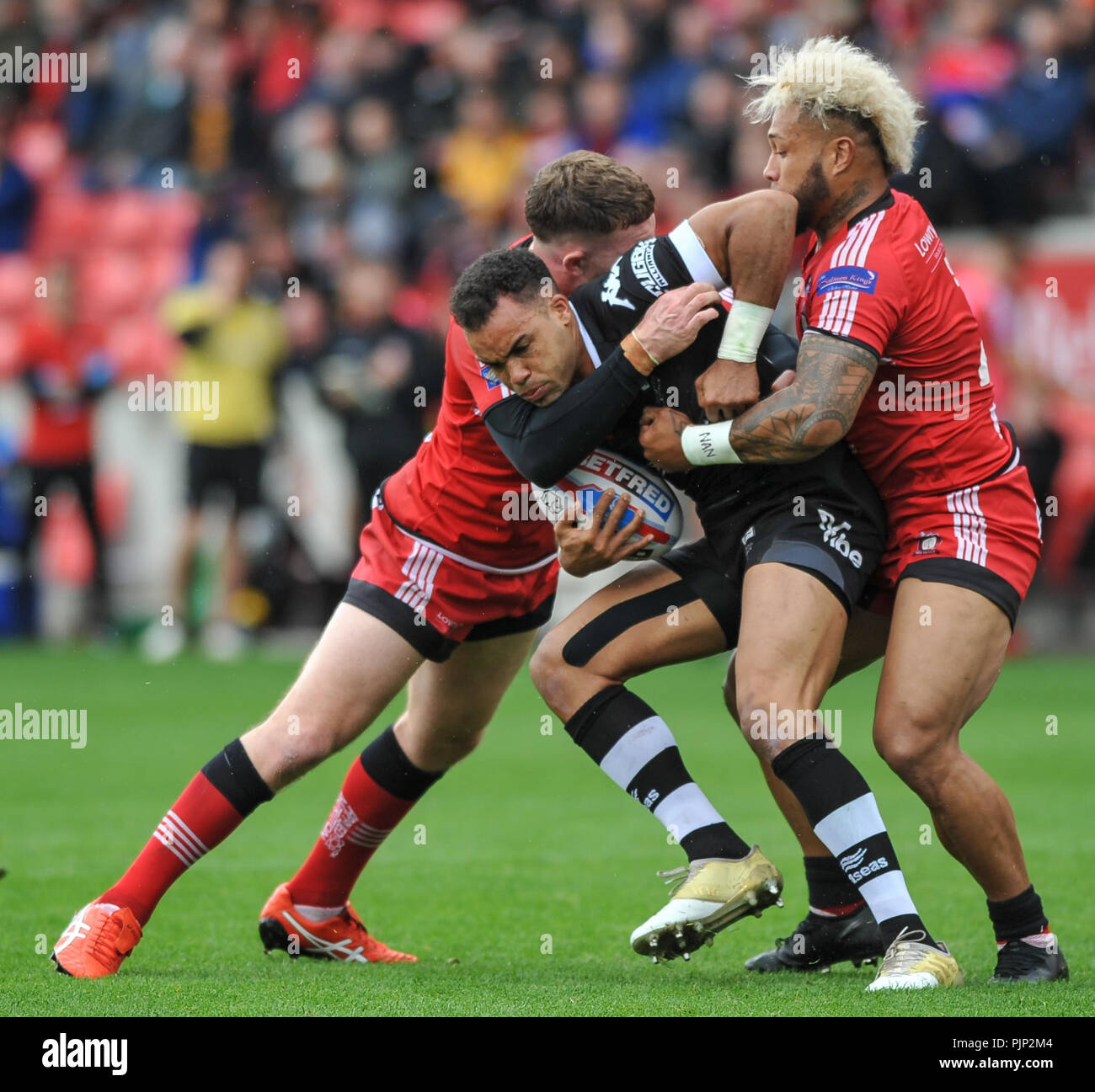Select Stadium, Salford, UK. 6th September 2018. Rugby League Super 8's Rugby League between Salford Red Devils vs Toronto Wolfpack; Mason Caton-Brown finds no way though against his former team.  Dean Williams Stock Photo