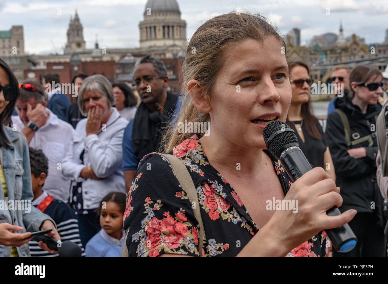 London, UK. 8th September 2018. Claire from Campaign Against Climate Change speaks at the Climate Reality rally in front of Tate Modern, one of thousands around the world demanding urgent action by government leaders to leaders commit to a fossil free world that works for all of us. Credit: Peter Marshall/Alamy Live News Stock Photo