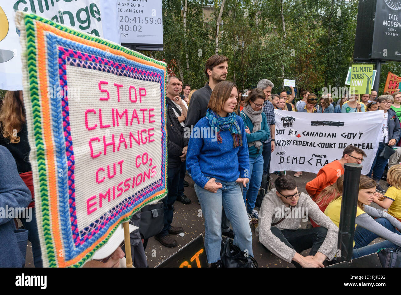 London, UK. 8th September 2018. Climate Reality supporters hold a rally in front of Tate Modern, one of thousands around the world demanding urgent action by government leaders to leaders commit to a fossil free world that works for all of us.  community leaders, organisers, scientists, storytellers and others united to a Credit: Peter Marshall/Alamy Live News Stock Photo