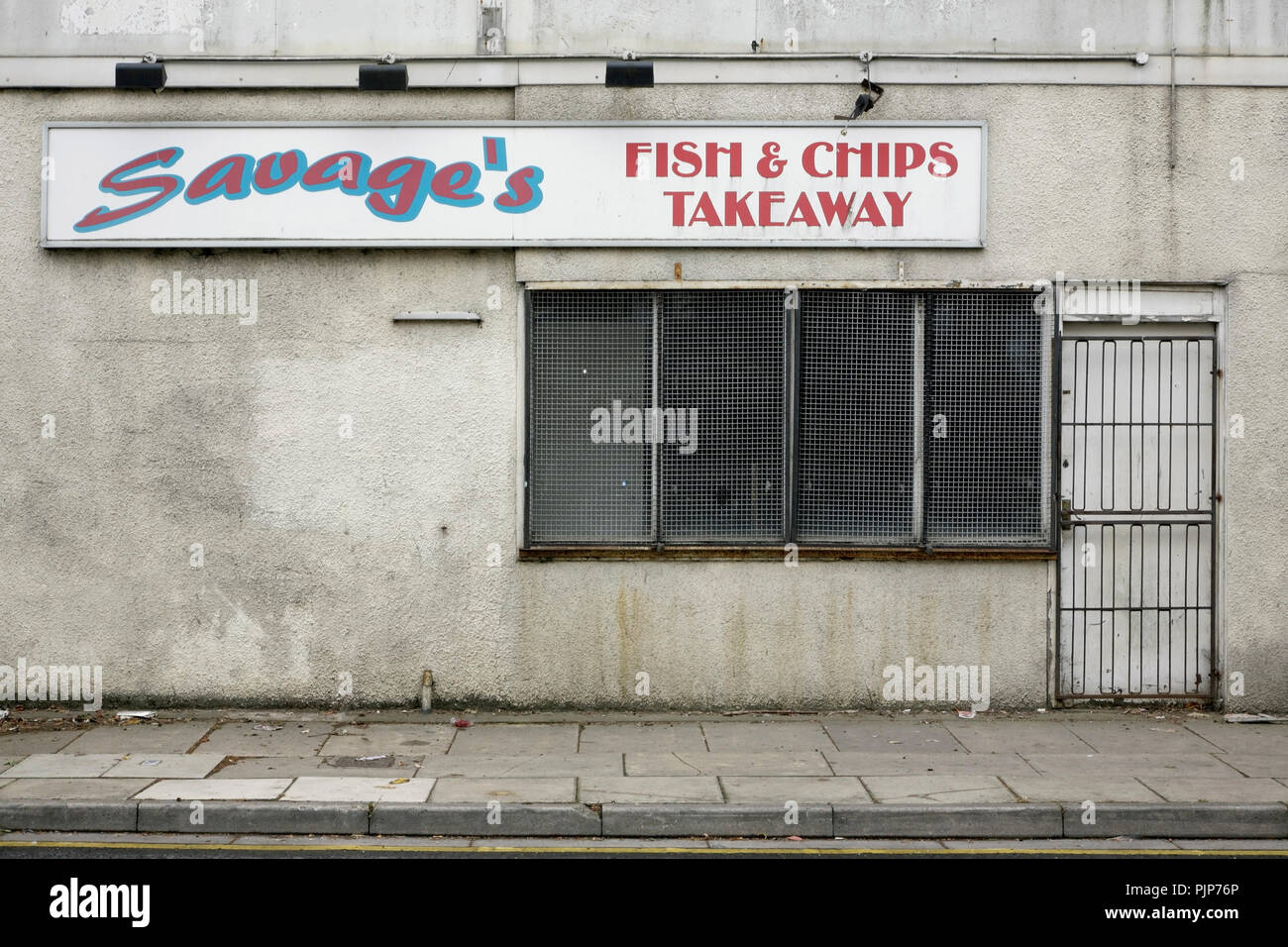 Closed and abandoned fish and chip shop, Oxford Street, Grimsby, UK