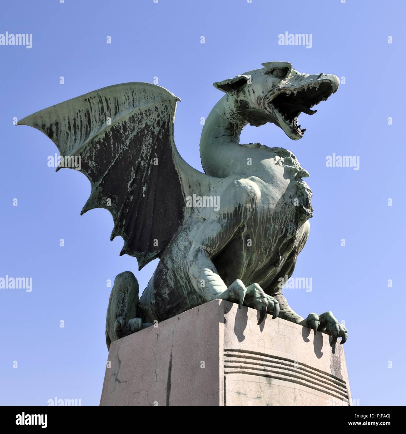 Bronze statue of a dragon on the Dragon Bridge, Zmajski Most, Ljubljana, Slovenia Stock Photo
