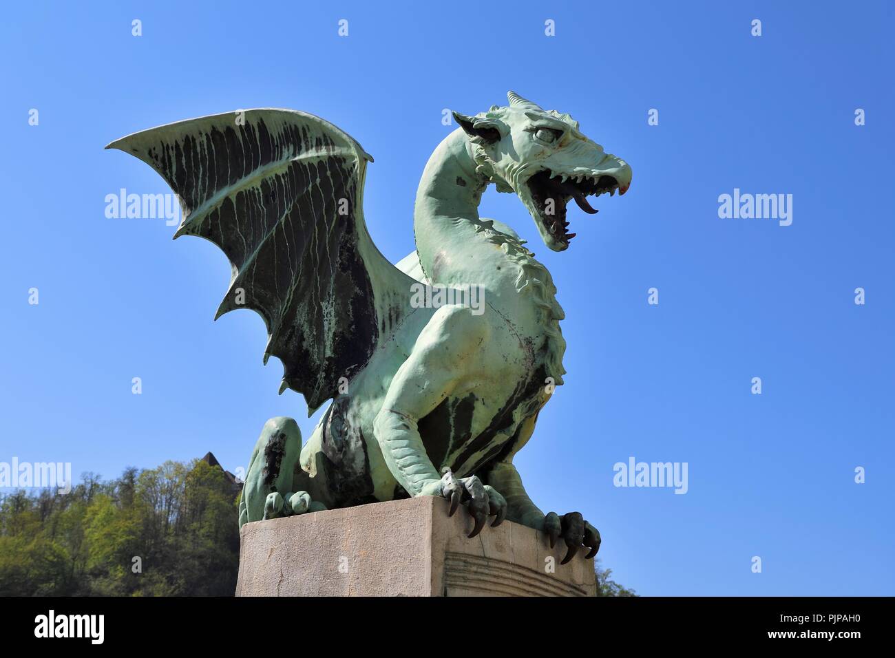 Bronze statue of a dragon on the Dragon Bridge, Zmajski Most, Ljubljana, Slovenia Stock Photo