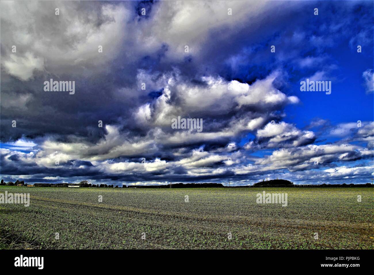 Summer cloud bursts over Sprotbrough farmland, in Doncaster, South Yorkshire, England. Stock Photo