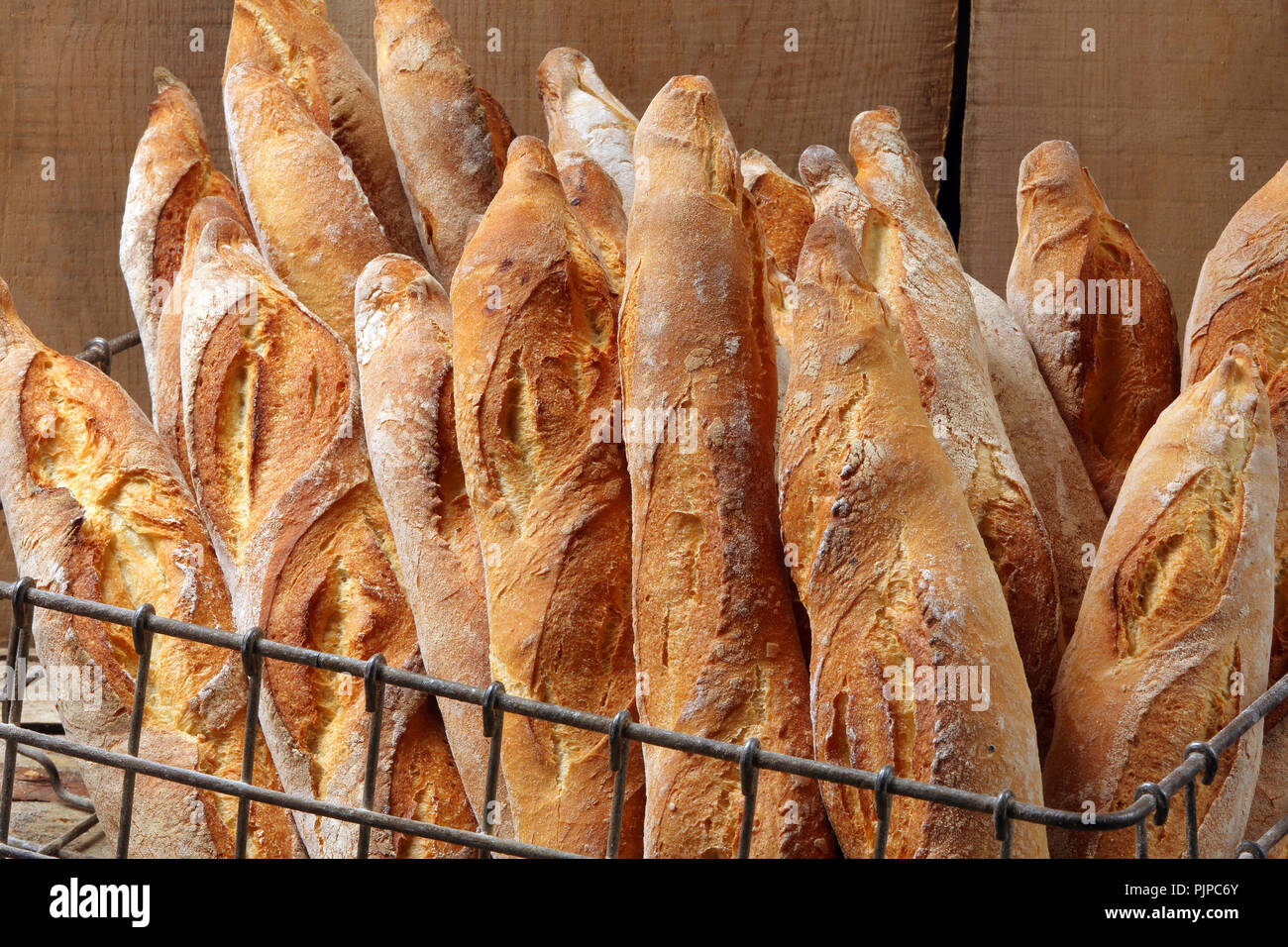 French baguette in metal basket Stock Photo Alamy