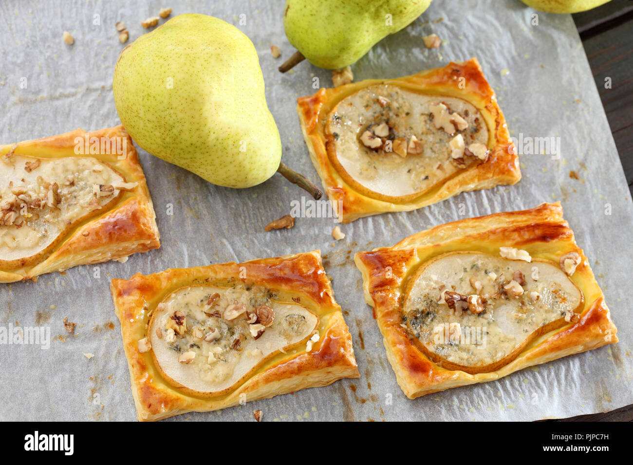 Puff pastry with baked pears, blue cheese and walnuts Stock Photo