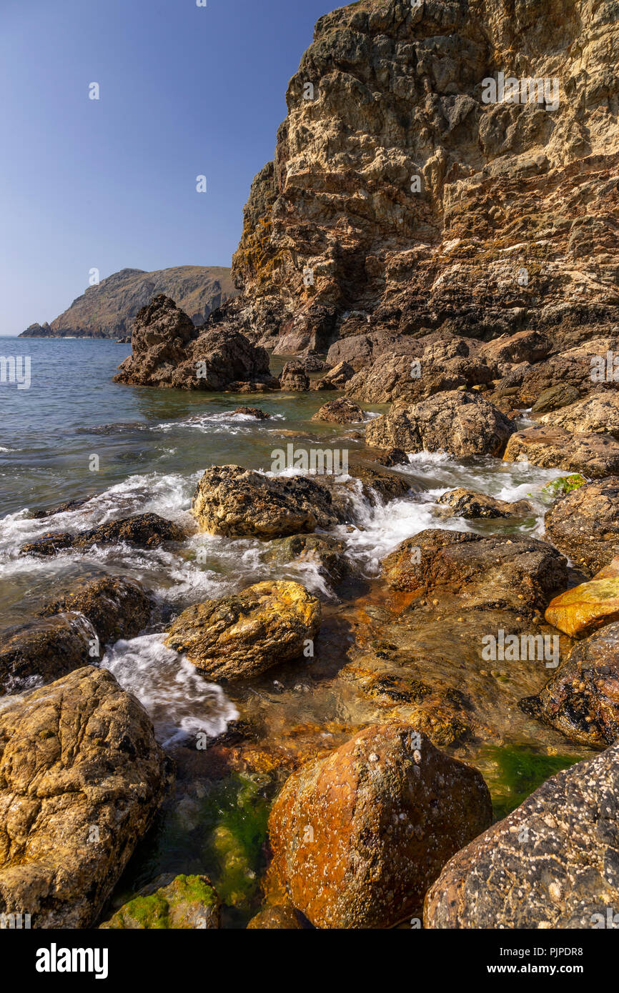 Cliffs at Ynys-y-Fydlyn on the coast of Anglesey, North Wales Stock Photo