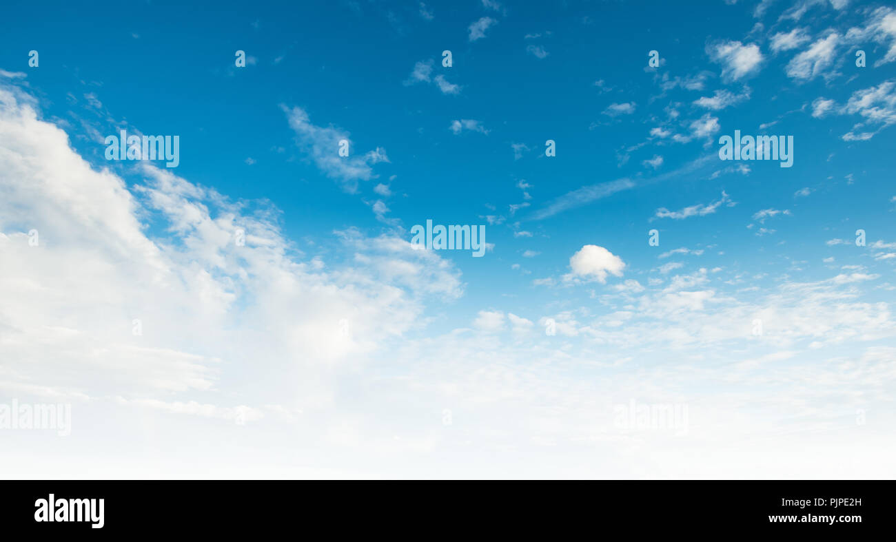 Clear blue sky and white clouds summer background Stock Photo - Alamy