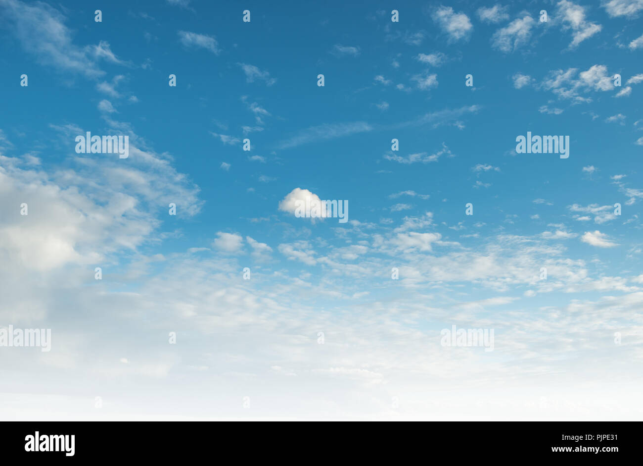 Clear blue sky and white clouds summer background Stock Photo - Alamy