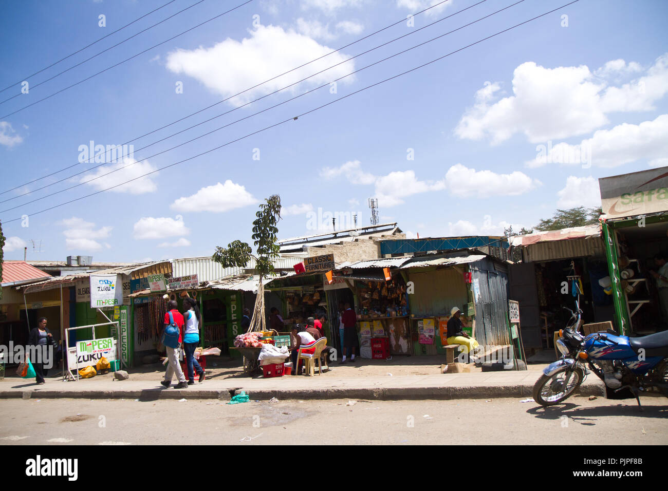 kenyan masai villages along the road to go to the masai mara reserve Stock Photo