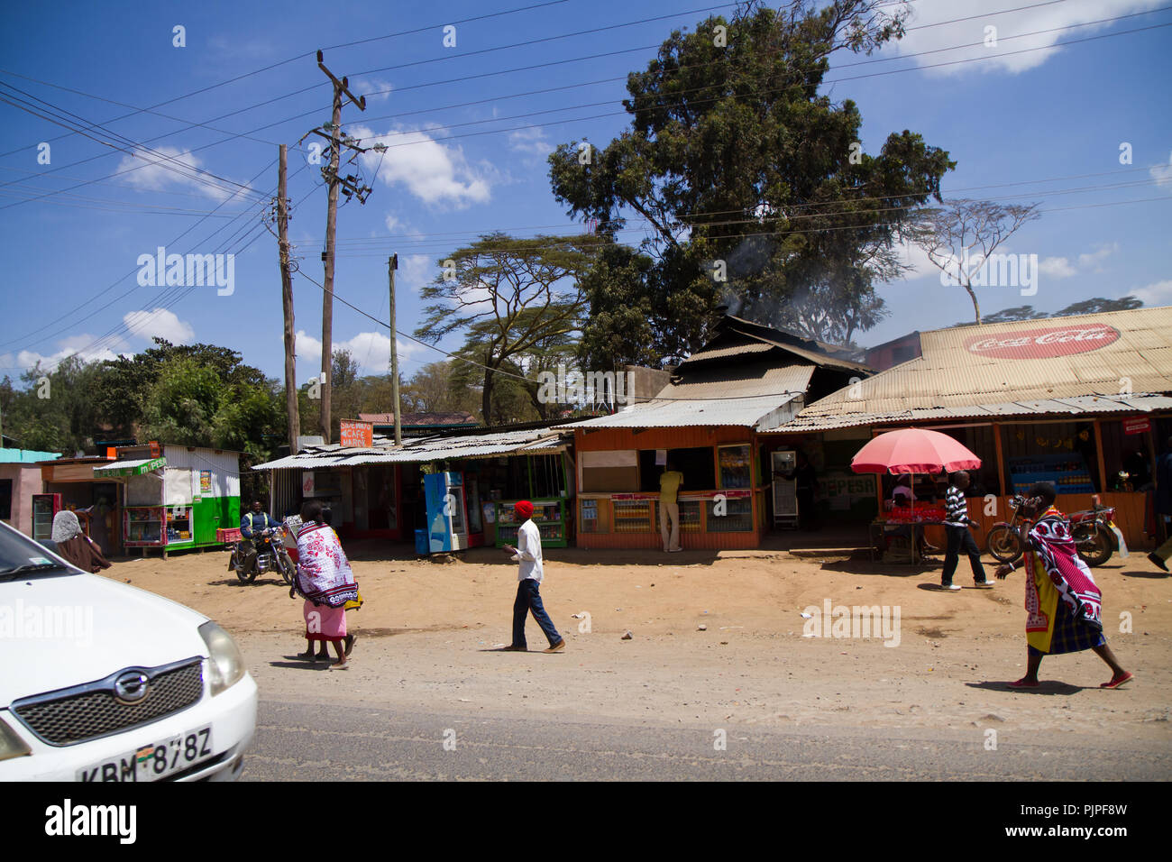 kenyan masai villages along the road to go to the masai mara reserve Stock Photo