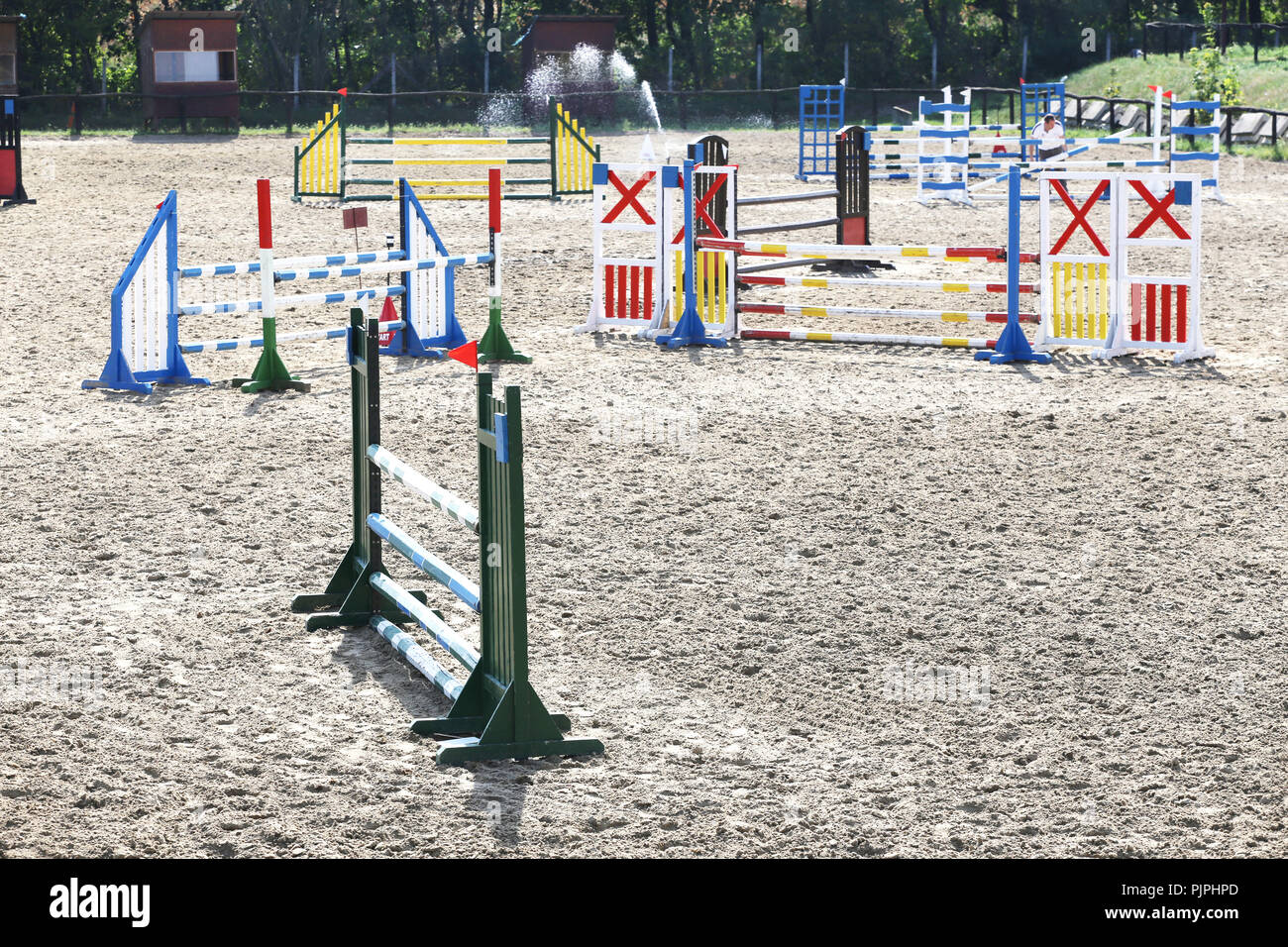 Multi colored image of show jumping poles at the show jumping arena