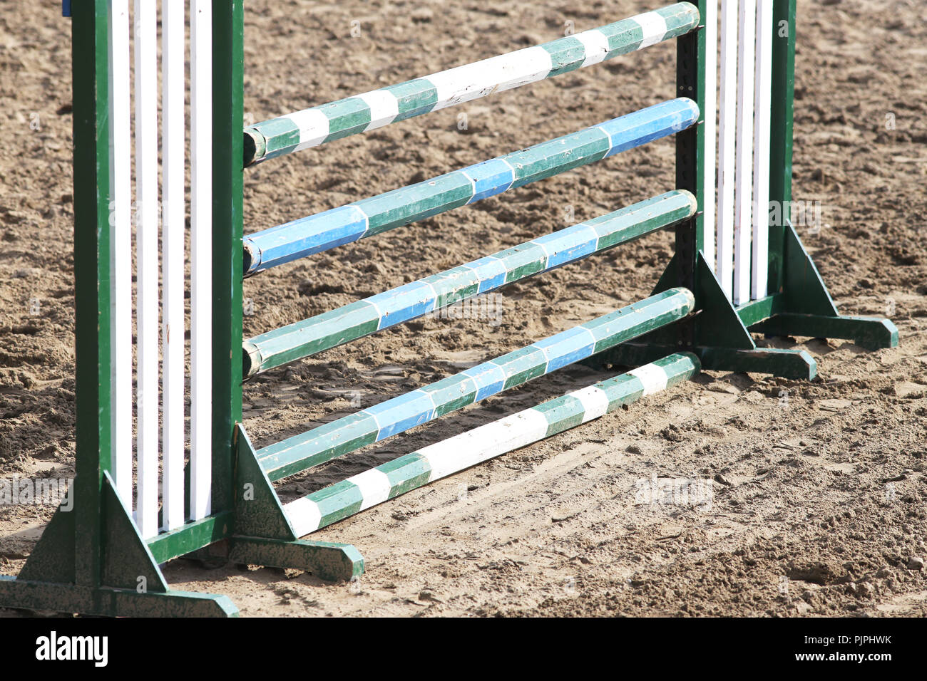 Multi colored image of show jumping poles at the show jumping arena