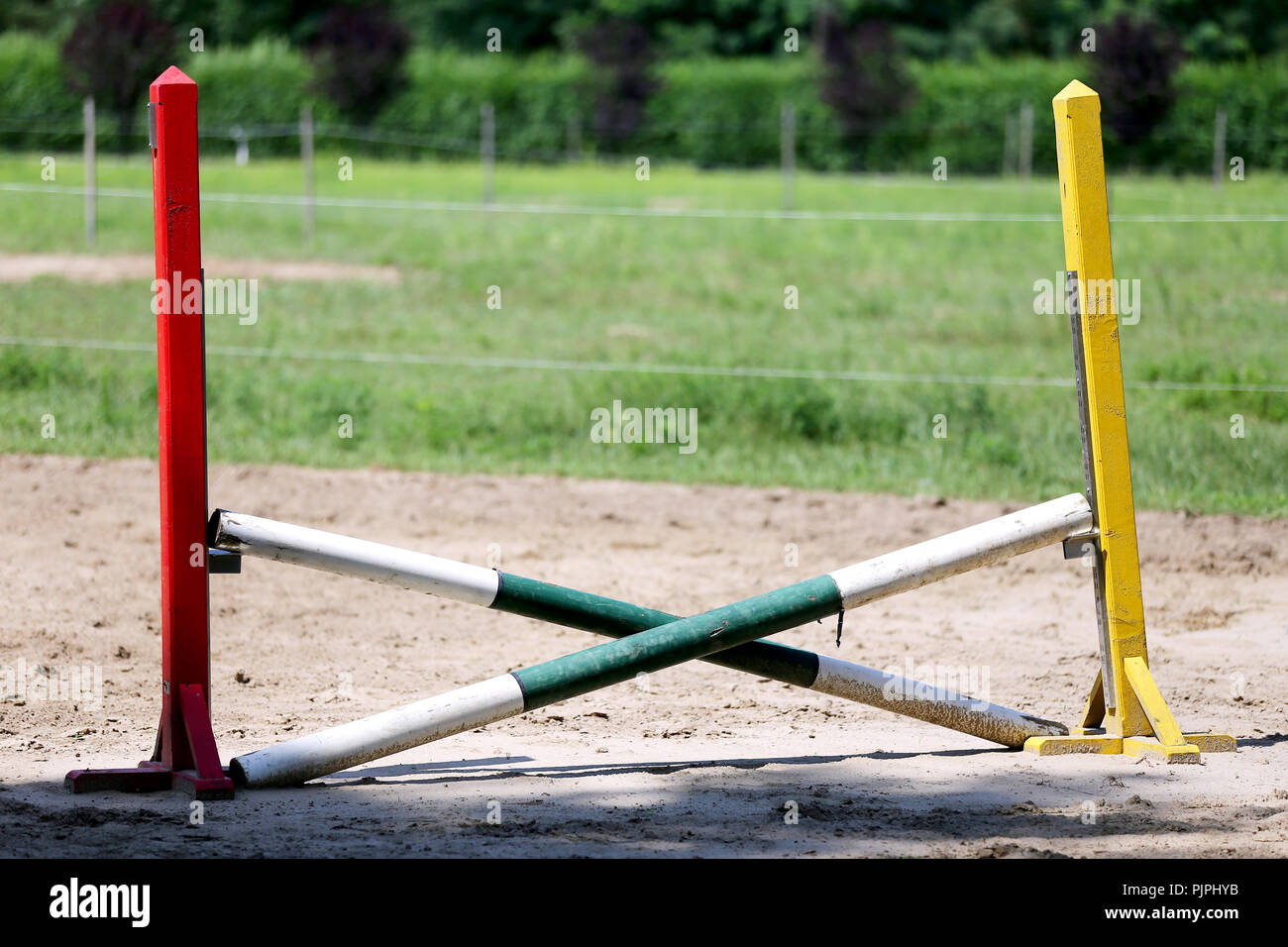 Multi colored image of show jumping poles at the show jumping arena