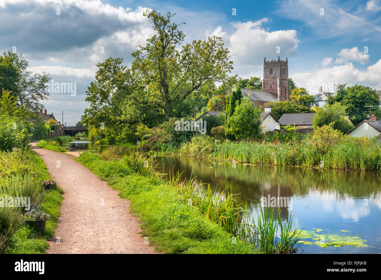 The Grand Western Canal runs through the middle of the picturesque Devon village of Sampford Peverell Stock Photo