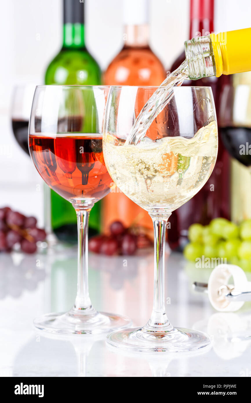 Wine pouring glass bottle white portrait format pour alcohol Stock Photo