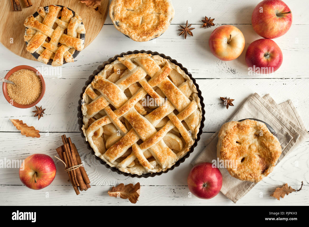 Homemade Apple Pies on white wooden background, top view. Classic