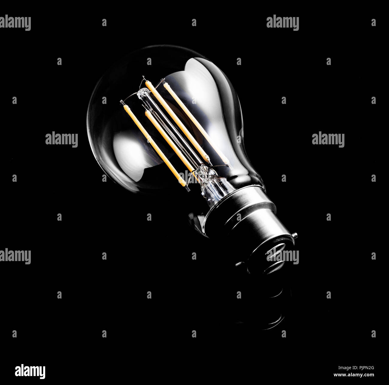 Low Energy Light Bulb on a dark background Stock Photo